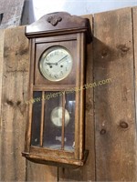 Wall clock in oak case