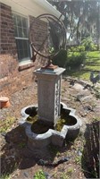 Armillary sphere on base with pond
