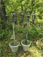 Pair of plastic planters with metal tiki torch