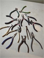 13 small specialized pliers and cutters