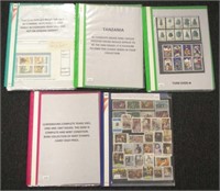 Five folders of world stamps