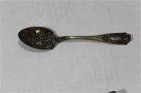 A Sterling Molive Ill Carved Spoon