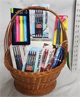 Basket full of new pens, notepads, highlighters+