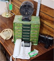organizer,  phone, fan, clock, and power strip