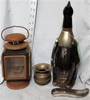 wiskey bottle, spitton, and lantern