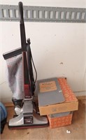 KIRBY UPRIGHT VAC W/ATTACHMENTS - HAS NEW PARTS,