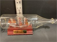 Small glass ship in a bottle