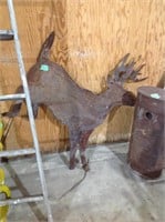 Metal deer, front legs bent, stakes into ground