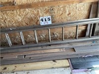Wooden ext. ladder & pile of lumber