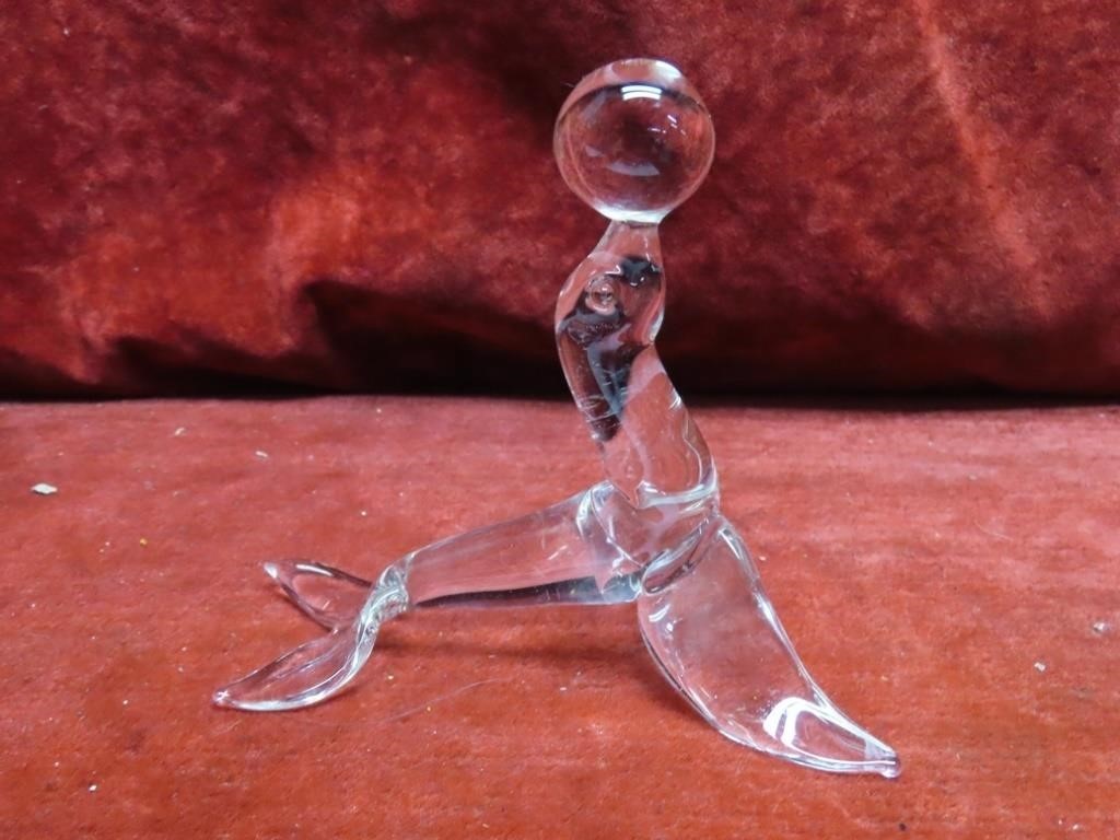 Blown glass seal w/ball figure.