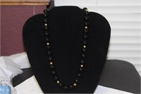 A 14 Kt Gold and Onyx Necklace