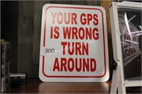 metal “your GPS is wrong” sign (lobby)