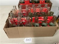 24 Coke bottles empty