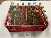 24 Coke bottles in Coke case