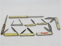 9 SLIP JOINT KNIVES W/ ADVERTISING ON THE SCALES
