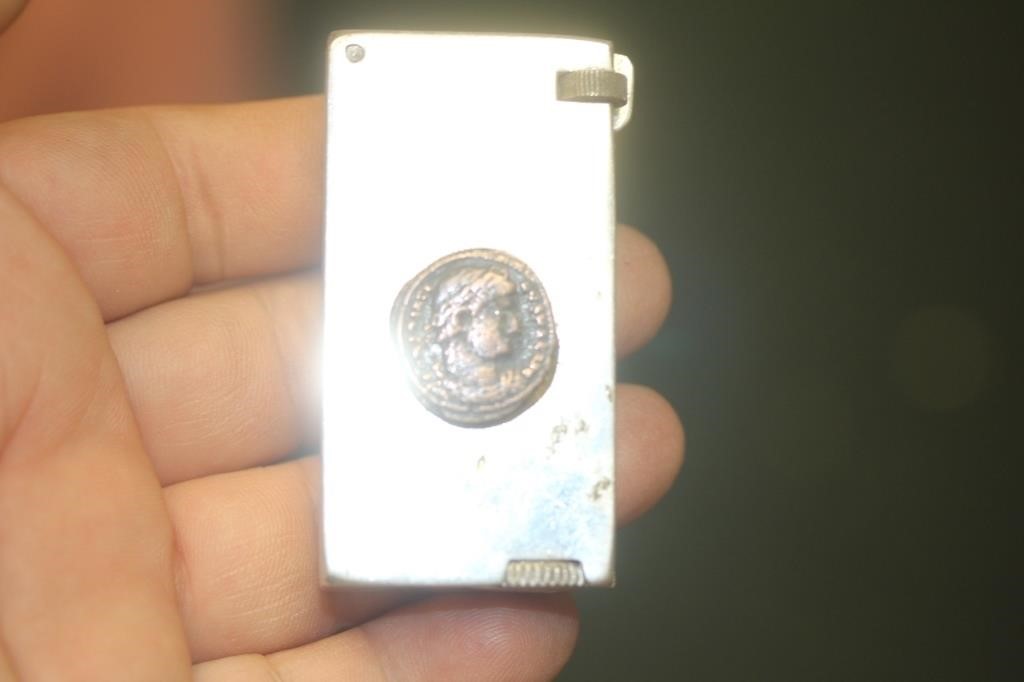 Crown Feather Flick with a Roman Coin Lighter