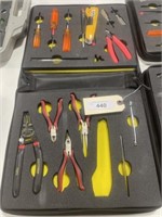 Assorted small tools, pliers, screwdrivers, and