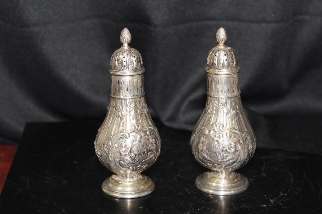 A Pair of Very Ornate Salt and Pepper Shakers