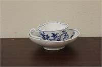 A Meissen Blue Onion Demitasse Cup and Saucer