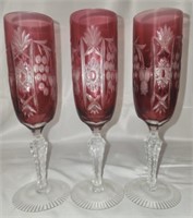 3 ruby colored crystal champagne glasses