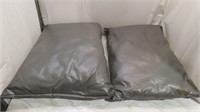 2 vinyl covered cushions