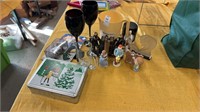 Two black wine glasses along with miscellaneous
