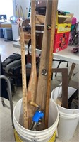 Bucket yard sticks oar and level
