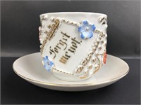 German cup and saucer.  Raised and relief design