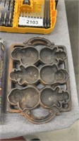 Vintage cast-iron Santa muffin tray