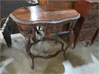 BEAUTIFULLY CARVED CHERUB STRETCHER BASE TABLE
