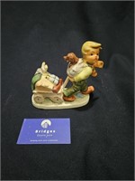 Friedel Porcelain Figurine 'Boy with Wagon'