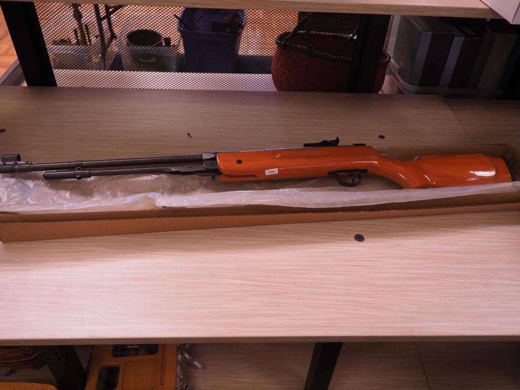 New air rifle with wooden stock in box