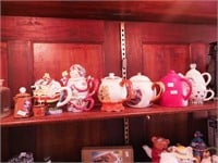 Six figural teapots and John Wayne salt and