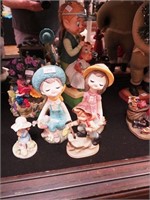 Five figurines, mostly depicting children