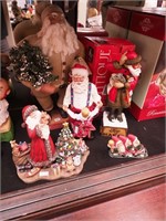 Five Christmas figurines, all Santa,