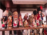 15 figurines: one nutcracker and 14 Santas from