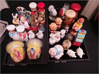 Two containers of figural salt and pepper shakers