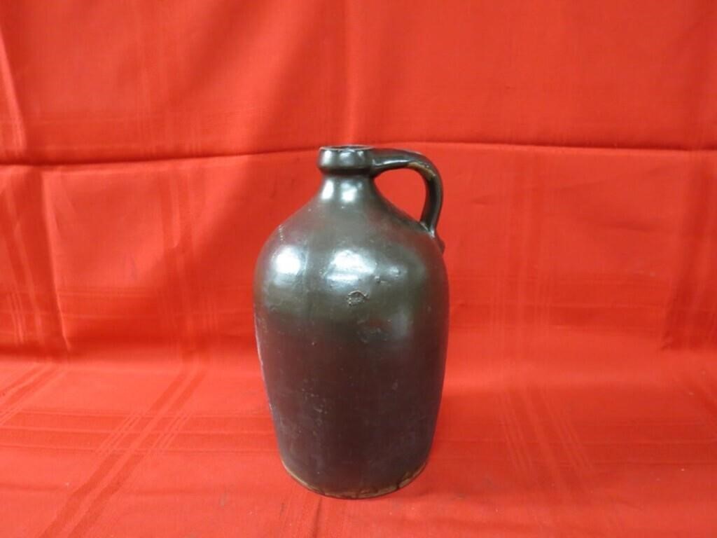 Antique stoneware brown glaze jug.