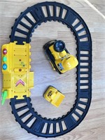Yellow train with track. Makes sounds.