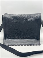 Genuine leather 
Purse is 14x12