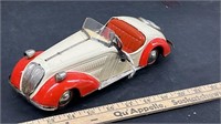 Tin Toy Wind Up Car. 10" long. With Key. Working