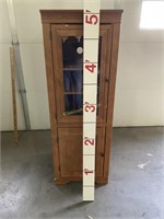 Tall cabinet with doors