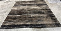 Area Rug  Black , Brown , Tan. 10’ x 7 4”