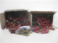 2 Boxes Used 12 GA. Shells & Bag Of 80 5.56 Brass