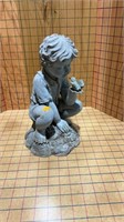 Boy statue, holding a bird