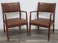 Pair of mid century leather arm chairs