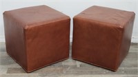 Pair of Norwalk Furniture leather ottomans on