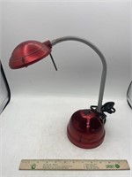 Metallic red desk, lamp, gooseneck