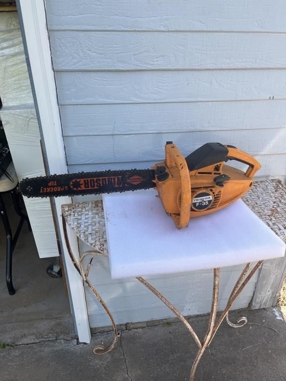 Vintage frontier chainsaw has compression model F