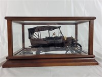 Model A car with collectors case, needs repair